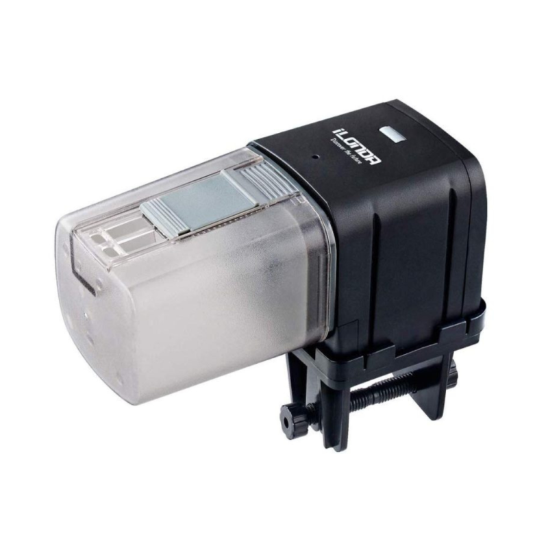 Automatic fish feeder clamped to an aquarium rim