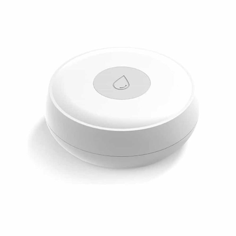 Zigbee water leak sensor on a bathroom floor beside a pipe